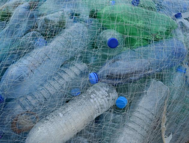Pile of empty plastics bottles in netting