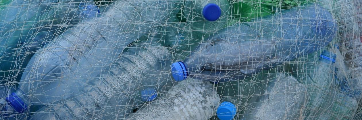 Pile of empty plastics bottles in netting