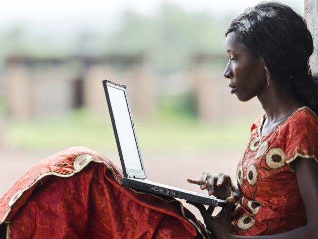 African woman using laptop